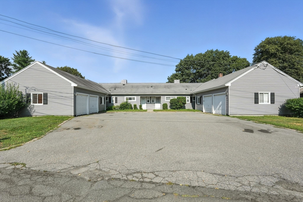 a view of house with outdoor space and street