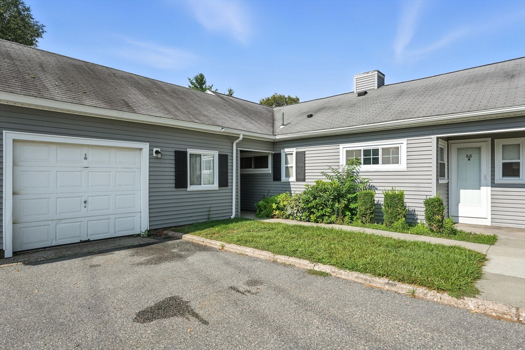 66 Applewood Drive, Unit 66 Chicopee, MA 01022 - Photo 4 of 25 a view of a house with a yard