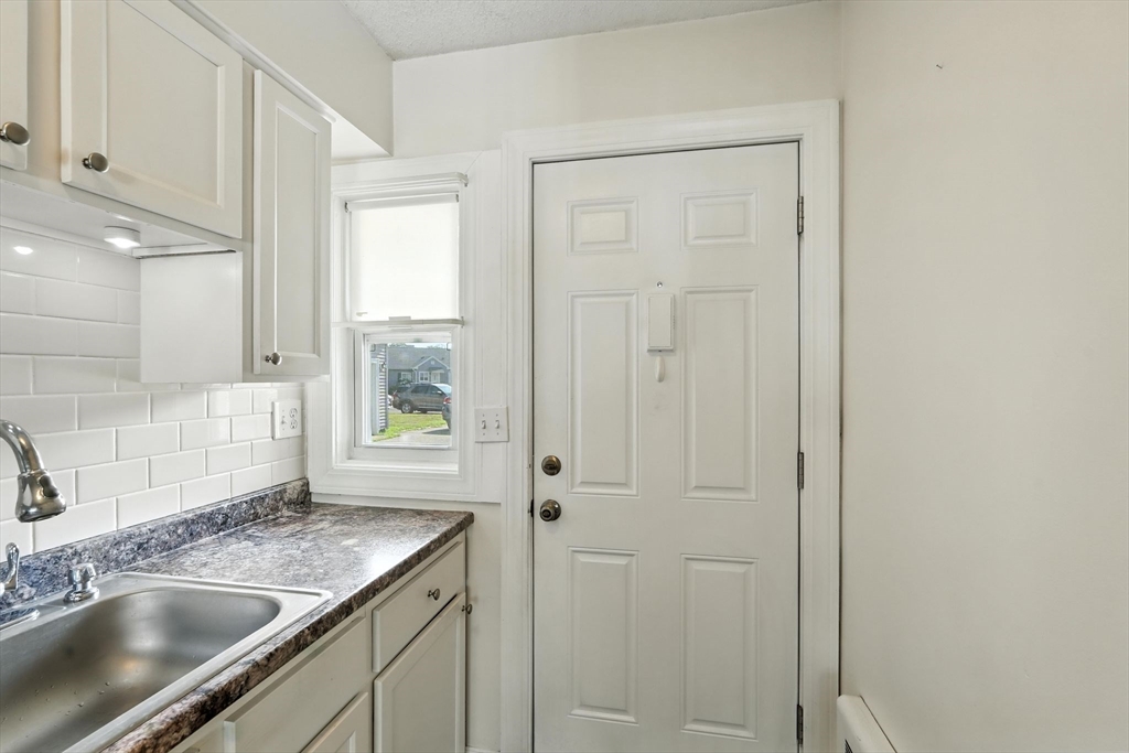 66 Applewood Drive, Unit 66 Chicopee, MA 01022 - Photo 5 of 25 a kitchen with a sink and cabinets
