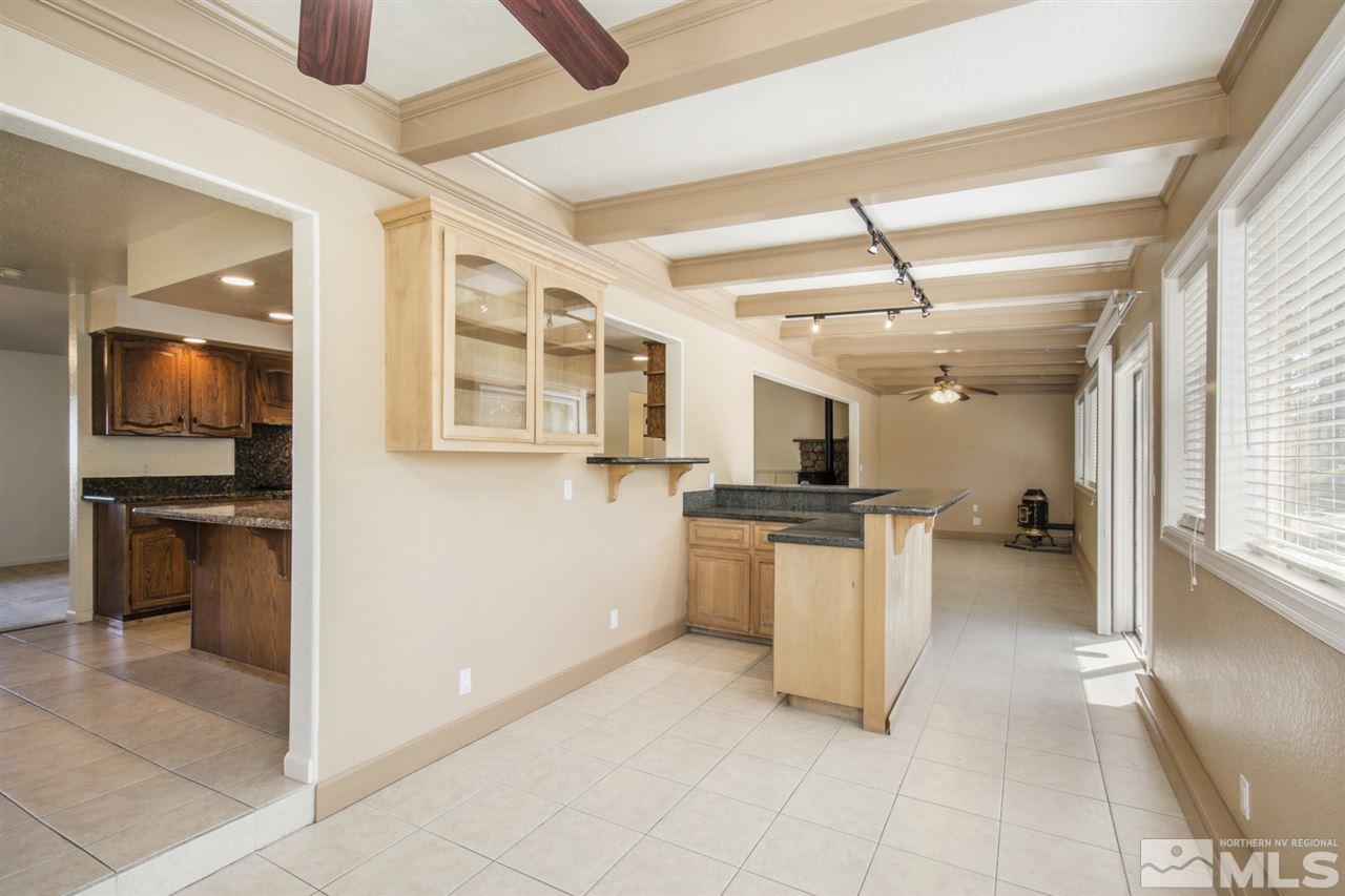12560 Thomas Creek Road Reno, NV 89511 - Photo 12 of 20 a kitchen with a refrigerator and a stove