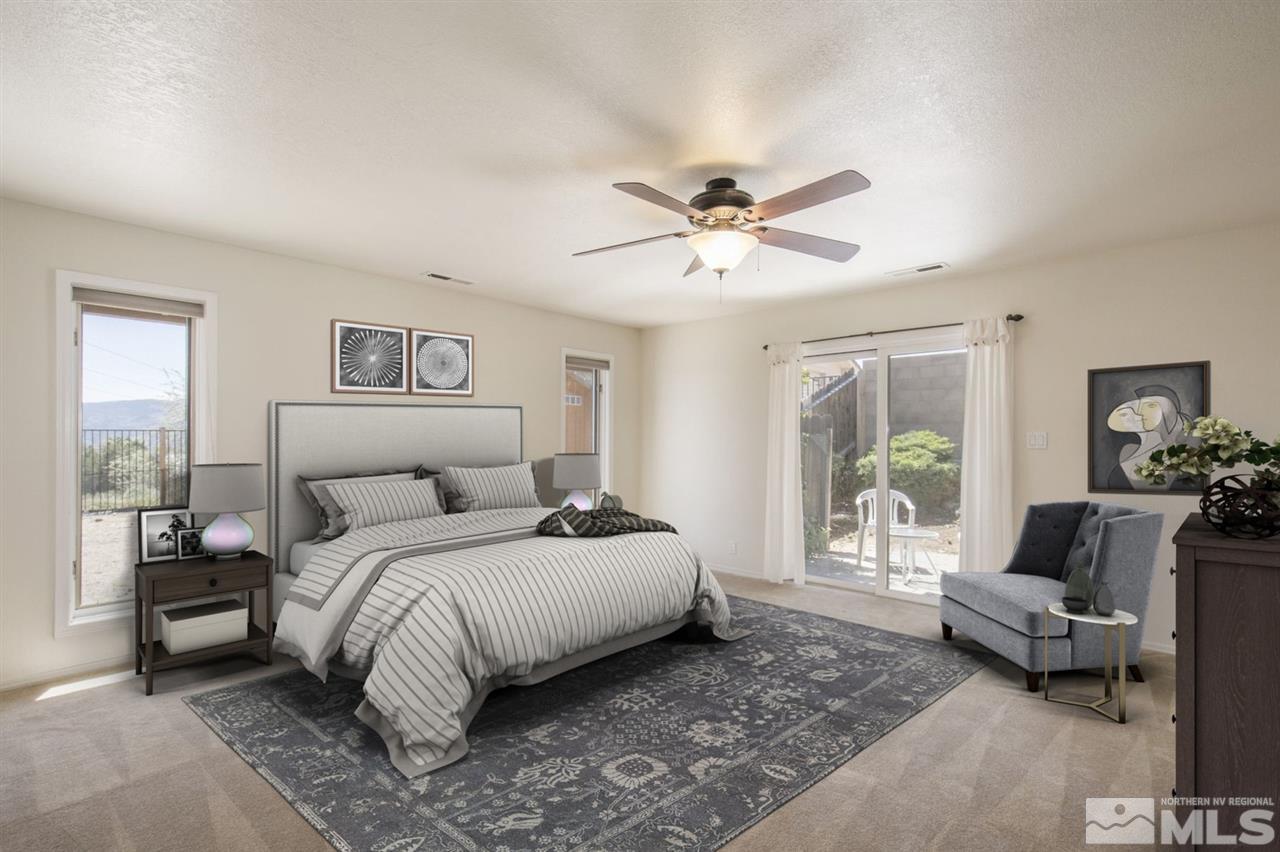 12560 Thomas Creek Road Reno, NV 89511 - Photo 13 of 20 a bedroom with a large bed and a couch