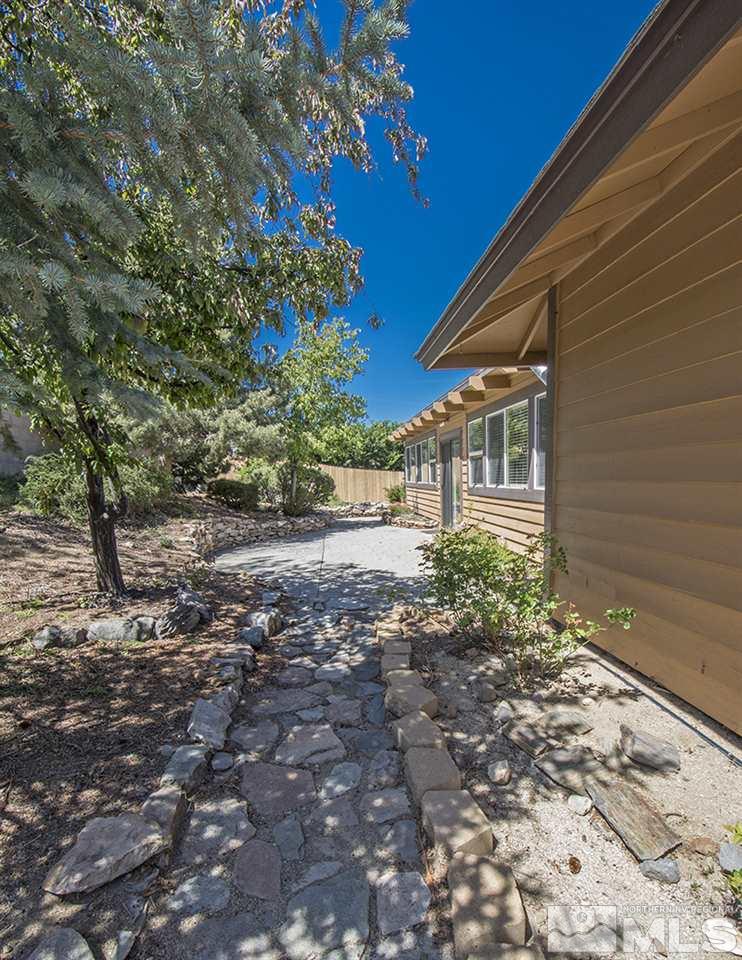 12560 Thomas Creek Road Reno, NV 89511 - Photo 19 of 20 a view of a yard with plants and large trees