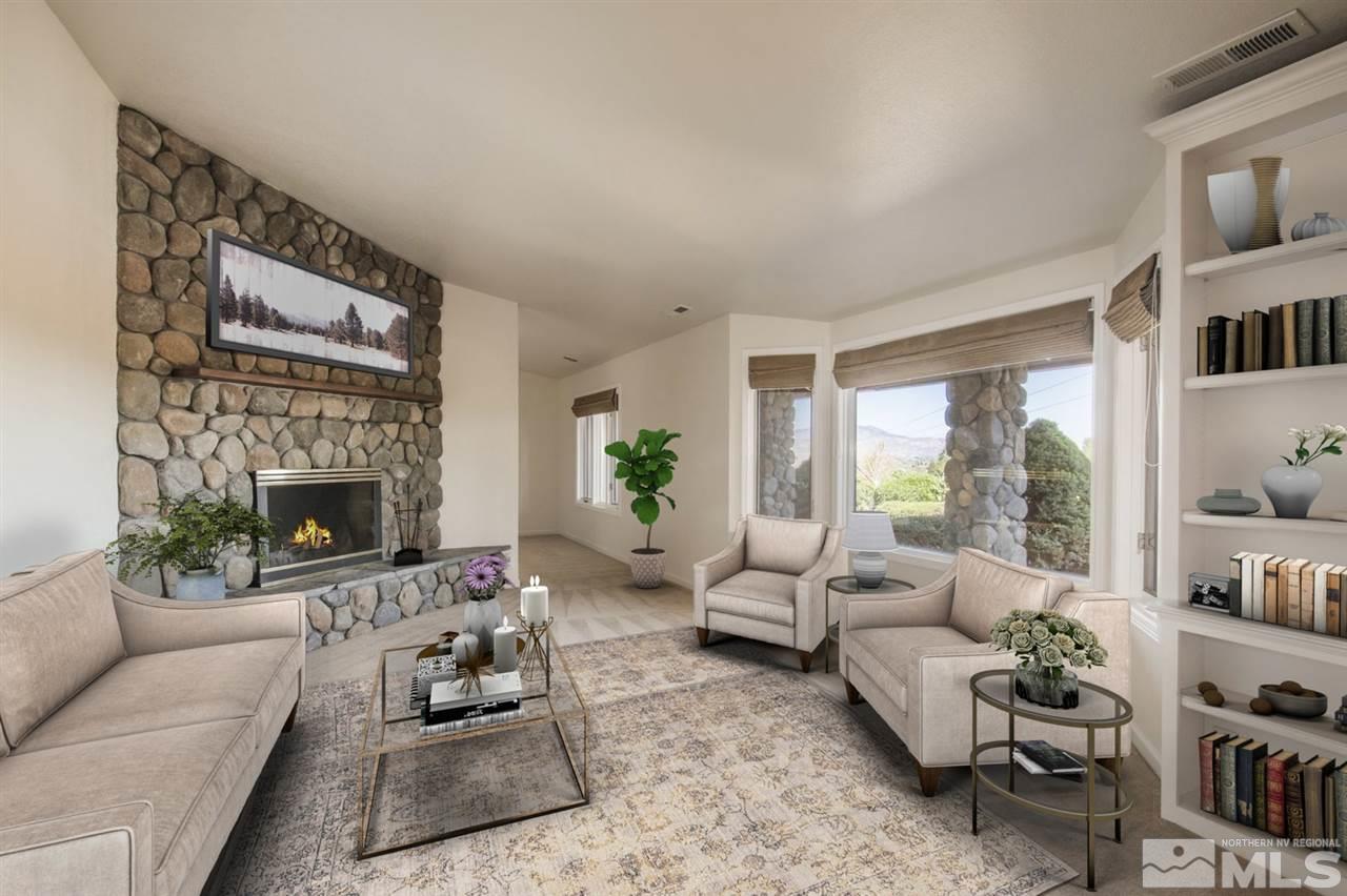12560 Thomas Creek Road Reno, NV 89511 - Photo 4 of 20 a living room with furniture fireplace and a large window