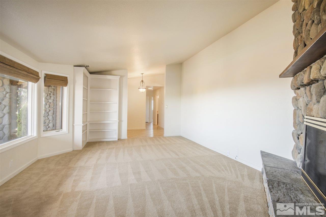 12560 Thomas Creek Road Reno, NV 89511 - Photo 6 of 20 a view of an empty room with a fireplace