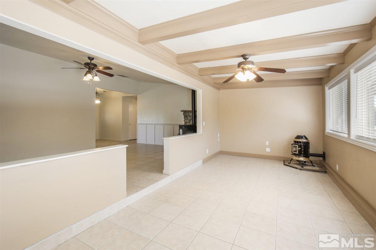 12560 Thomas Creek Road Reno, NV 89511 - Photo 7 of 20 wooden floor in an empty room with a window
