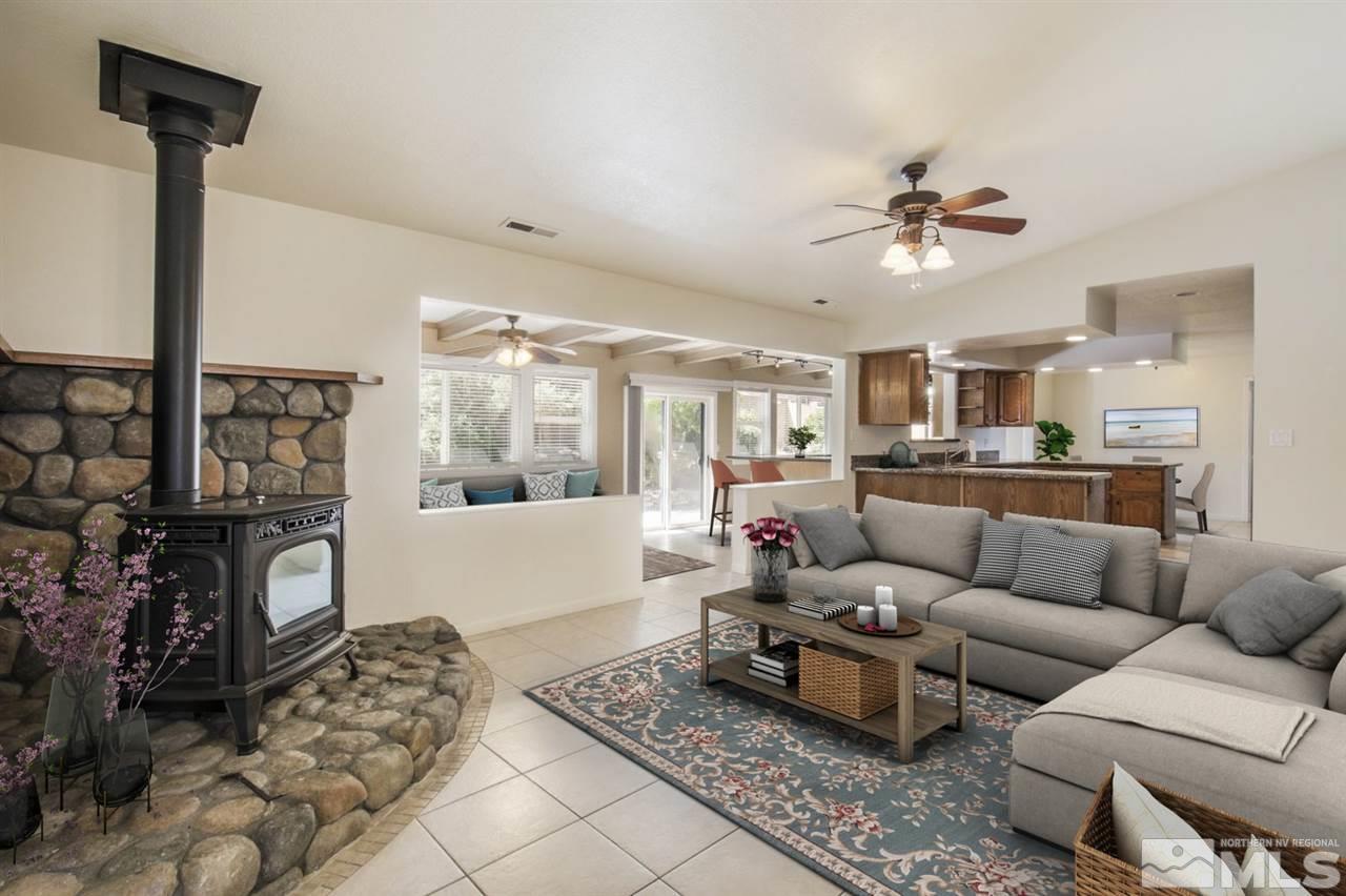 12560 Thomas Creek Road Reno, NV 89511 - Photo 10 of 20 a living room with furniture wooden floor and a table