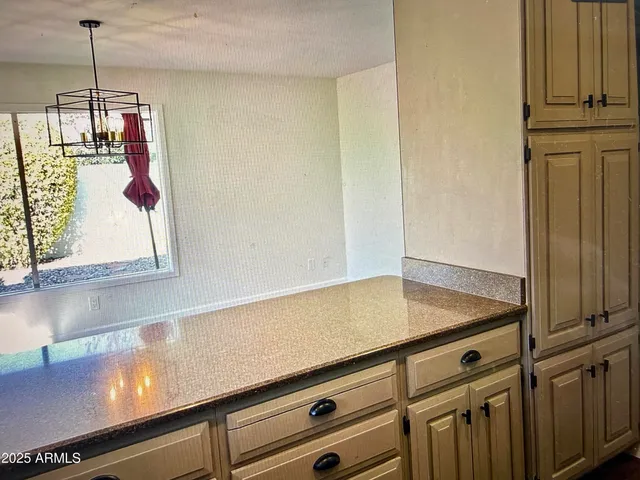 a view of a kitchen counter space with furniture