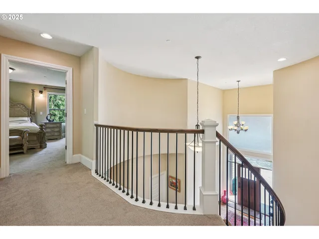 a view of a hallway view with staircase