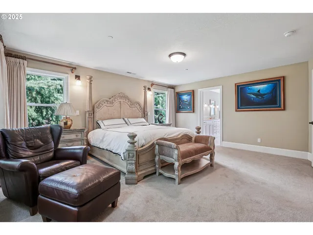 a bedroom with a bed couch and window