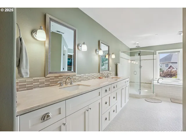 a bathroom with a granite countertop sink mirror and double