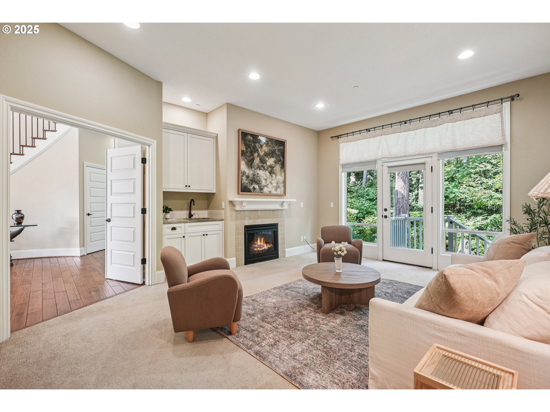 1621 Southeast McBrod Avenue Milwaukie, OR 97222 - Photo 28 of 41 a living room with furniture a fireplace and a large window