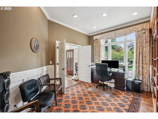 a living room with furniture rug and a window