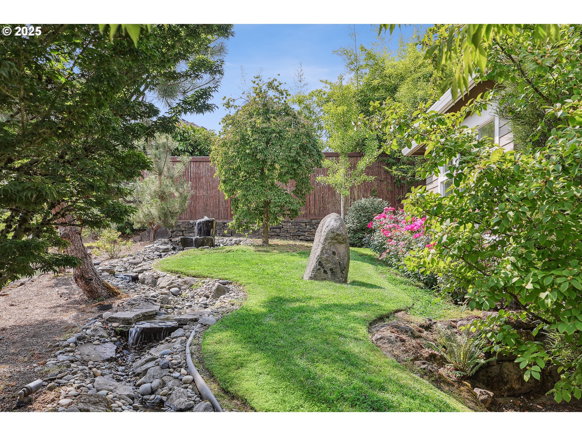 1621 Southeast McBrod Avenue Milwaukie, OR 97222 - Photo 38 of 41 a garden with trees in front of it