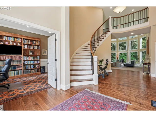 a view of a living room and wooden floor