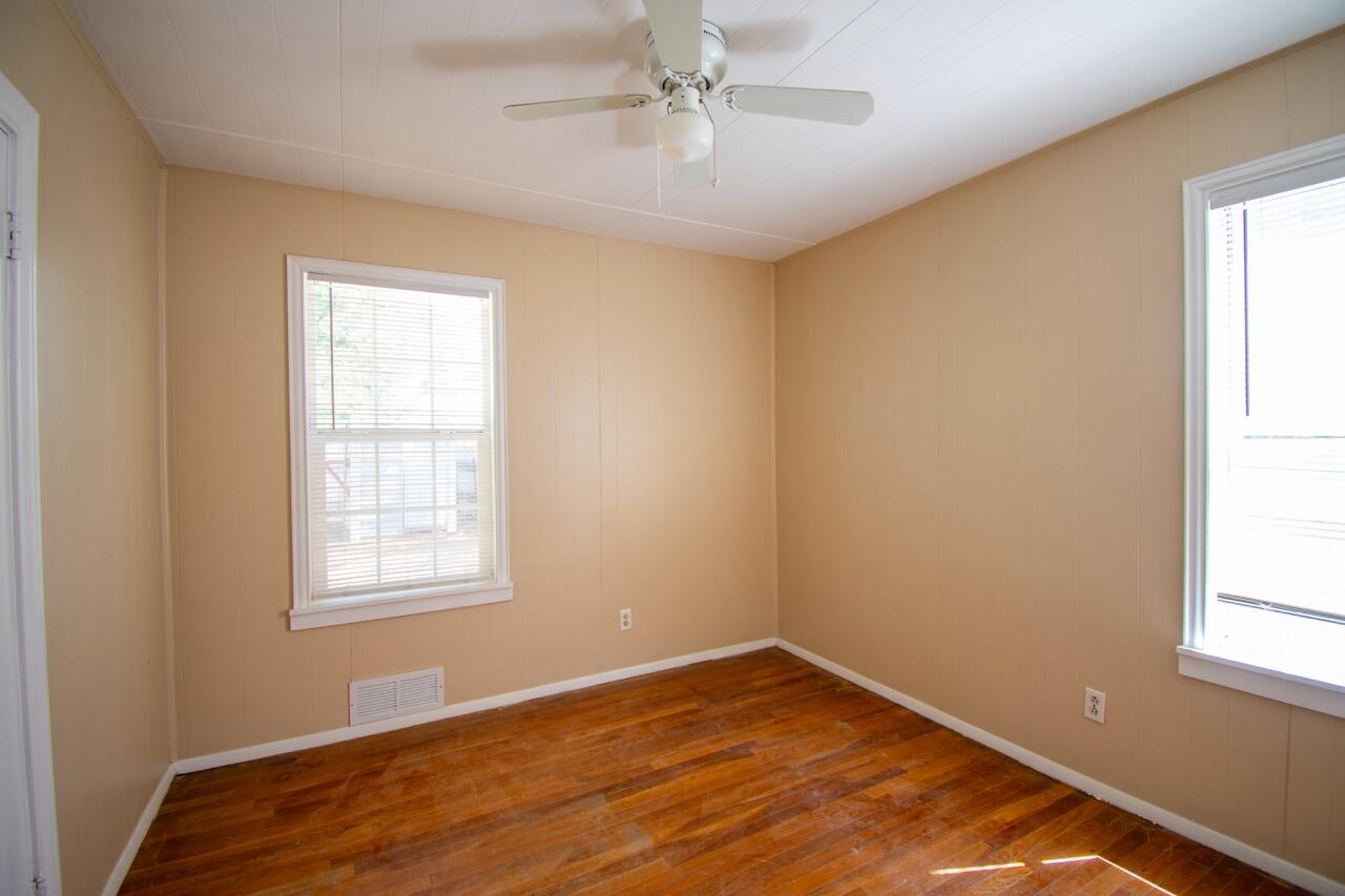 2424 27th Street Lubbock, TX 79411 - Photo 11 of 14 an empty room with windows and fan