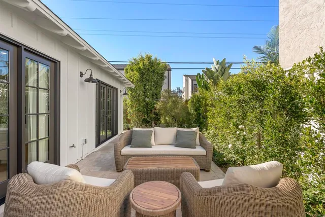 a outdoor living space with furniture and a potted plant