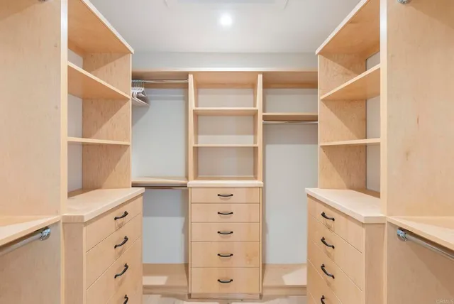 a view of an empty walk in closet