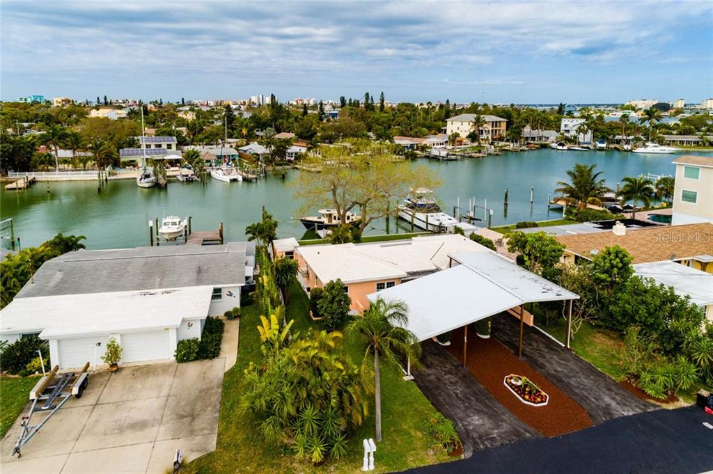 COMPLETELY UPDATED DUPLEX WITH COVETED COVERED PARKING FOR 10+ VEHICLES