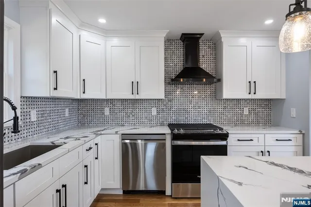 a bathroom with a sink a mirror and a shower