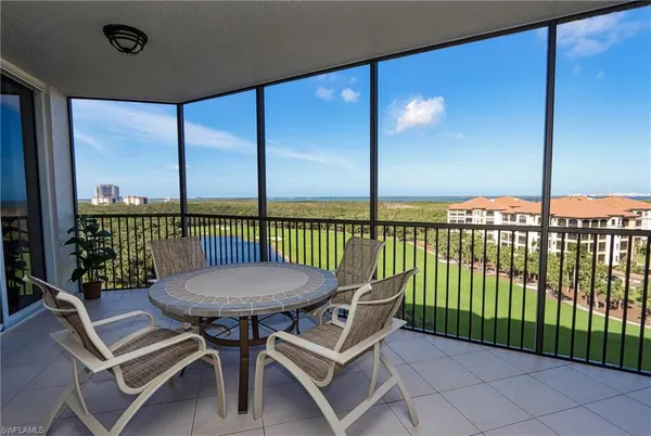 a view of a balcony with furniture