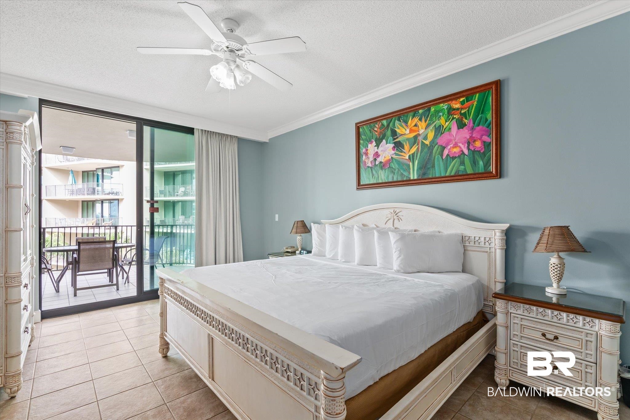 27580 Canal Road, Unit 1322 Orange Beach, AL 36561 - Photo 11 of 30 Bedroom with access to exterior, light tile patterned flooring, ceiling fan, ornamental molding, and a textured ceiling