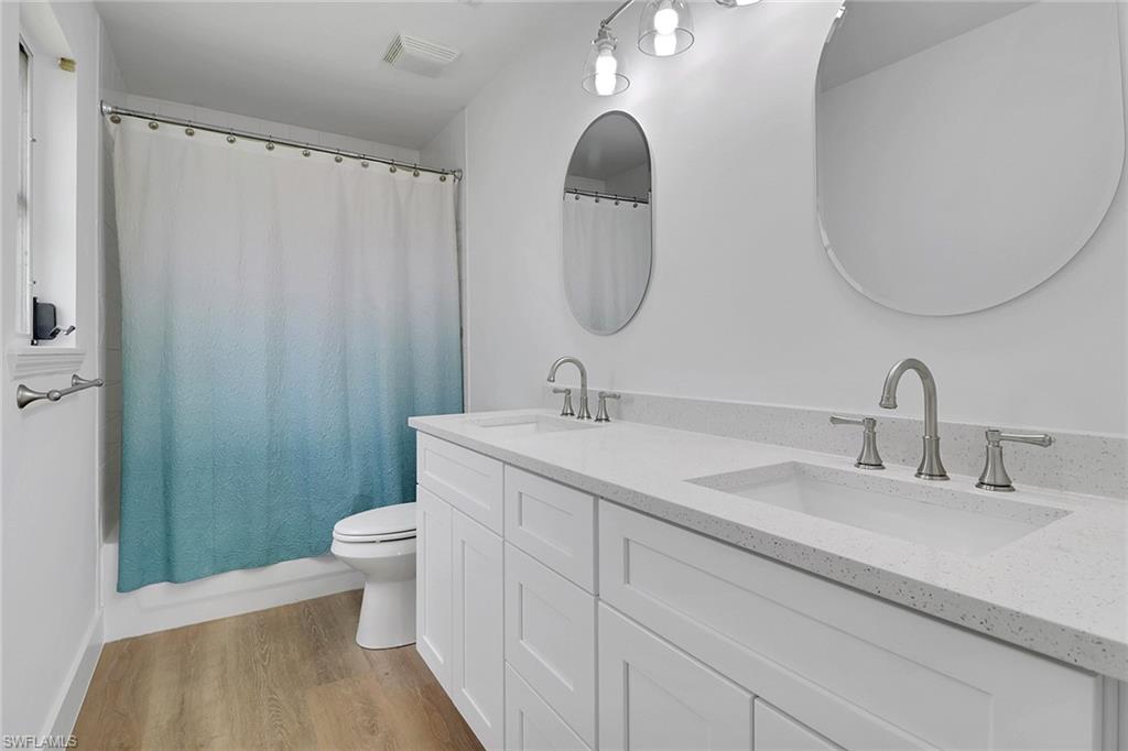 3659 Riviera Circle Bonita Springs, FL 34134 - Photo 13 of 31 a bathroom with a sink and a mirror