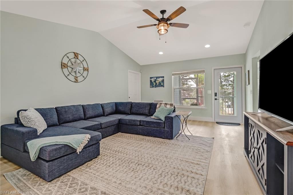 3659 Riviera Circle Bonita Springs, FL 34134 - Photo 18 of 31 a living room with furniture and a flat screen tv