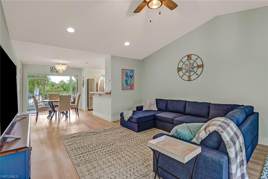 3659 Riviera Circle Bonita Springs, FL 34134 - Photo 19 of 31 a living room with furniture and a table