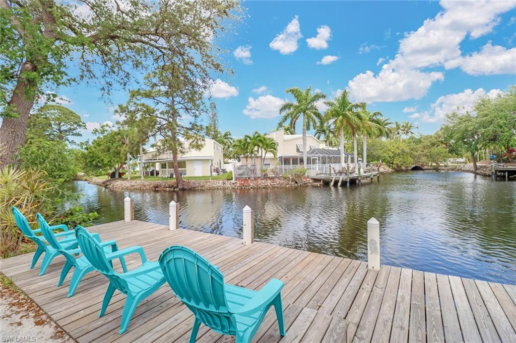 3659 Riviera Circle Bonita Springs, FL 34134 - Photo 2 of 31 a lake view with a seating space