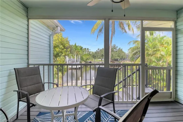 a view of a balcony with furniture and wooden floor