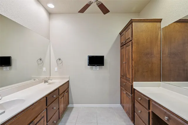 a bathroom with a double vanity sink a and mirror