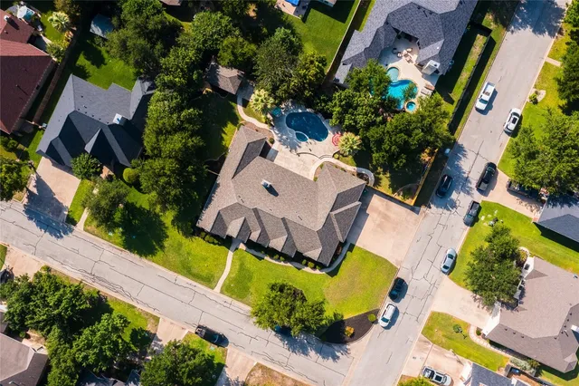 an aerial view of a house with yard swimming pool and outdoor seating