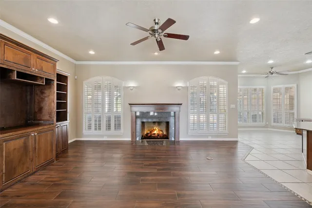 a living room with furniture fireplace and flat screen tv