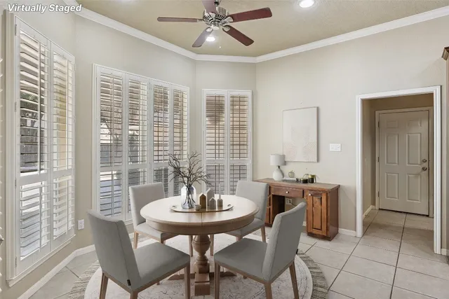 a dining room with furniture and window