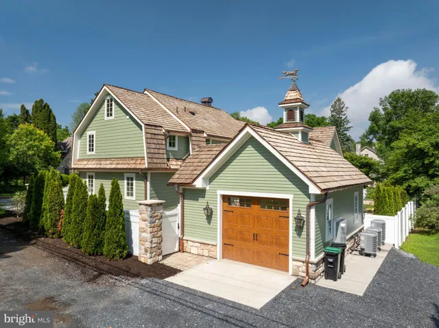 a bedroom with a bed dresser and a window