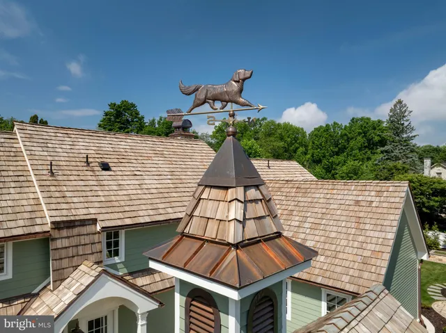 a bathroom with a toilet a sink and a mirror