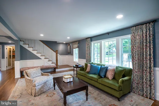 a bedroom with a bed and a night stand