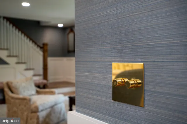 a view of a livingroom with wooden floor and furniture