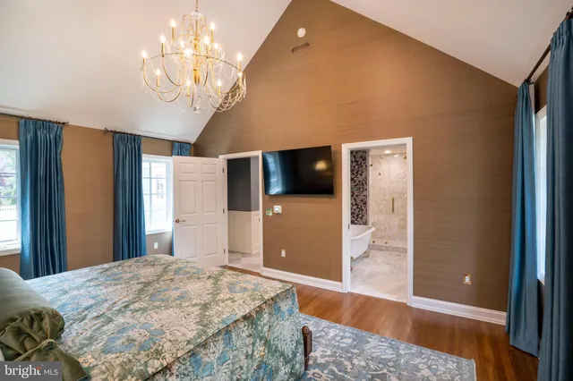 a view of a living room with furniture and a flat screen tv