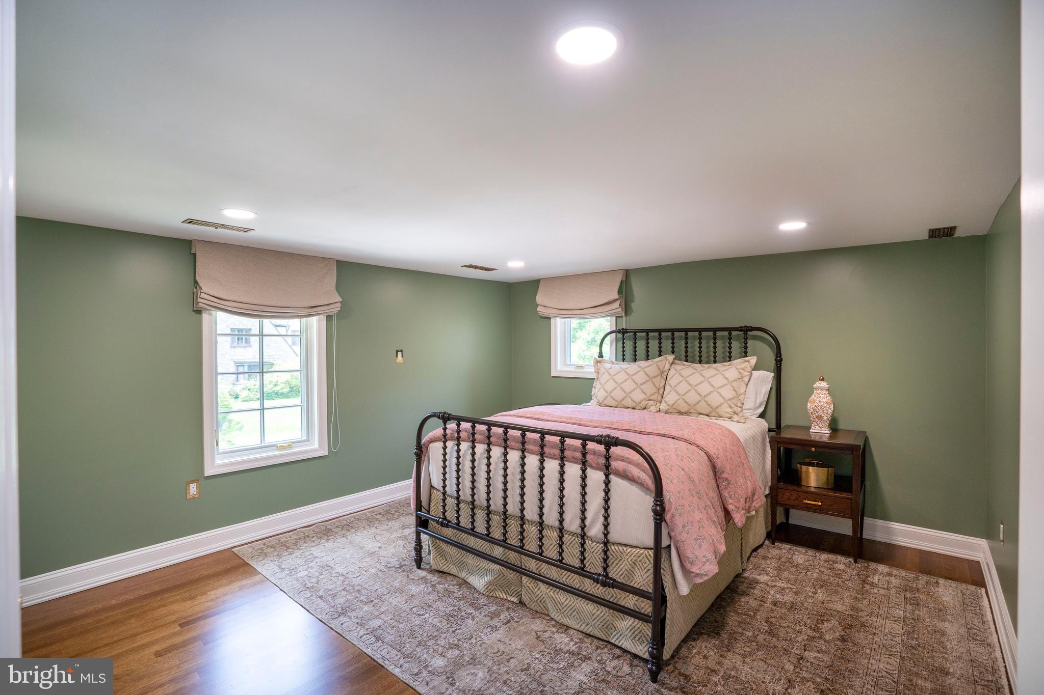 619 McKee Street State College, PA 16803 - Photo 84 of 101 a bed sitting in a spacious bedroom next to a window and chandelier