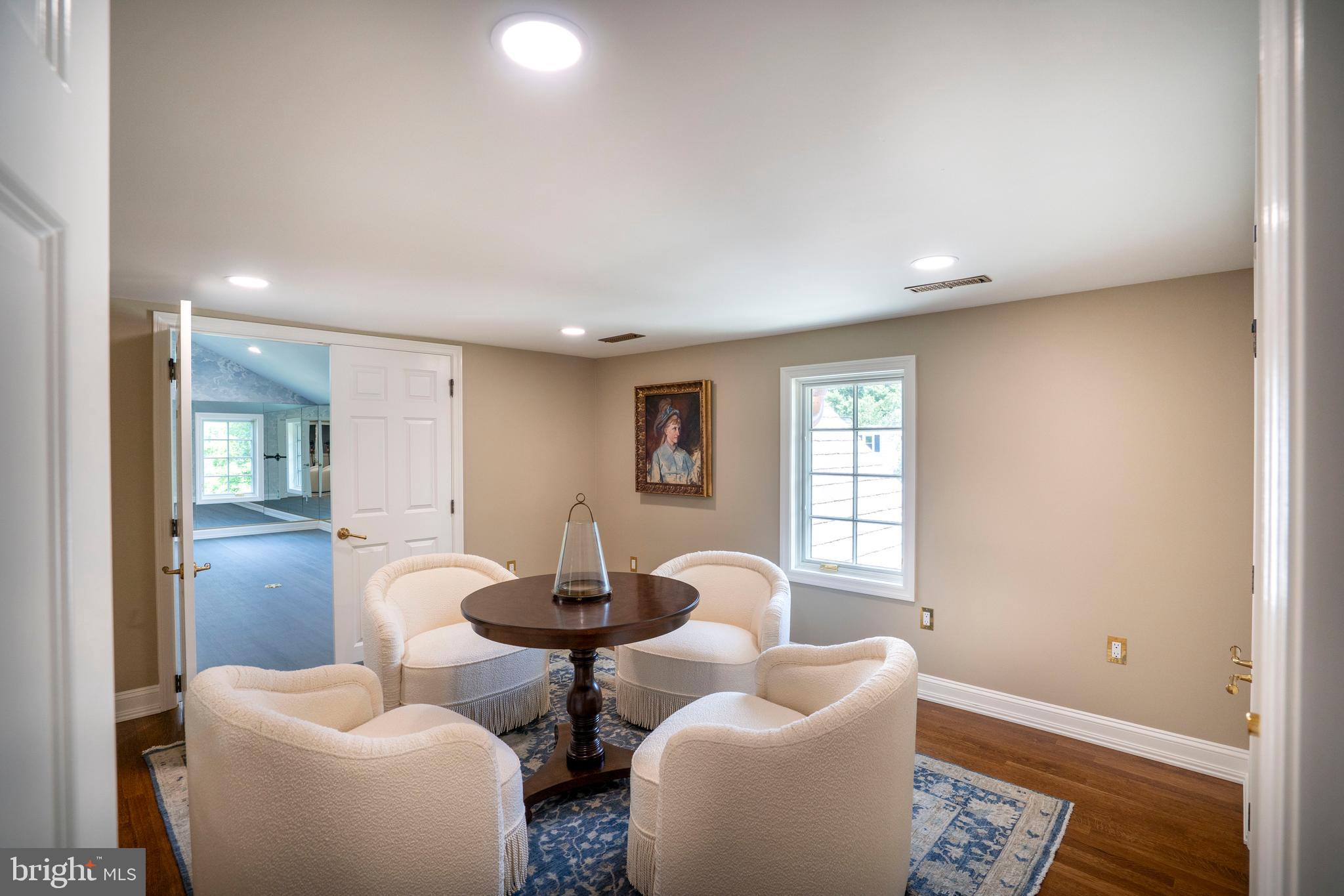 619 McKee Street State College, PA 16803 - Photo 88 of 101 a living room with furniture a large window and wooden floor