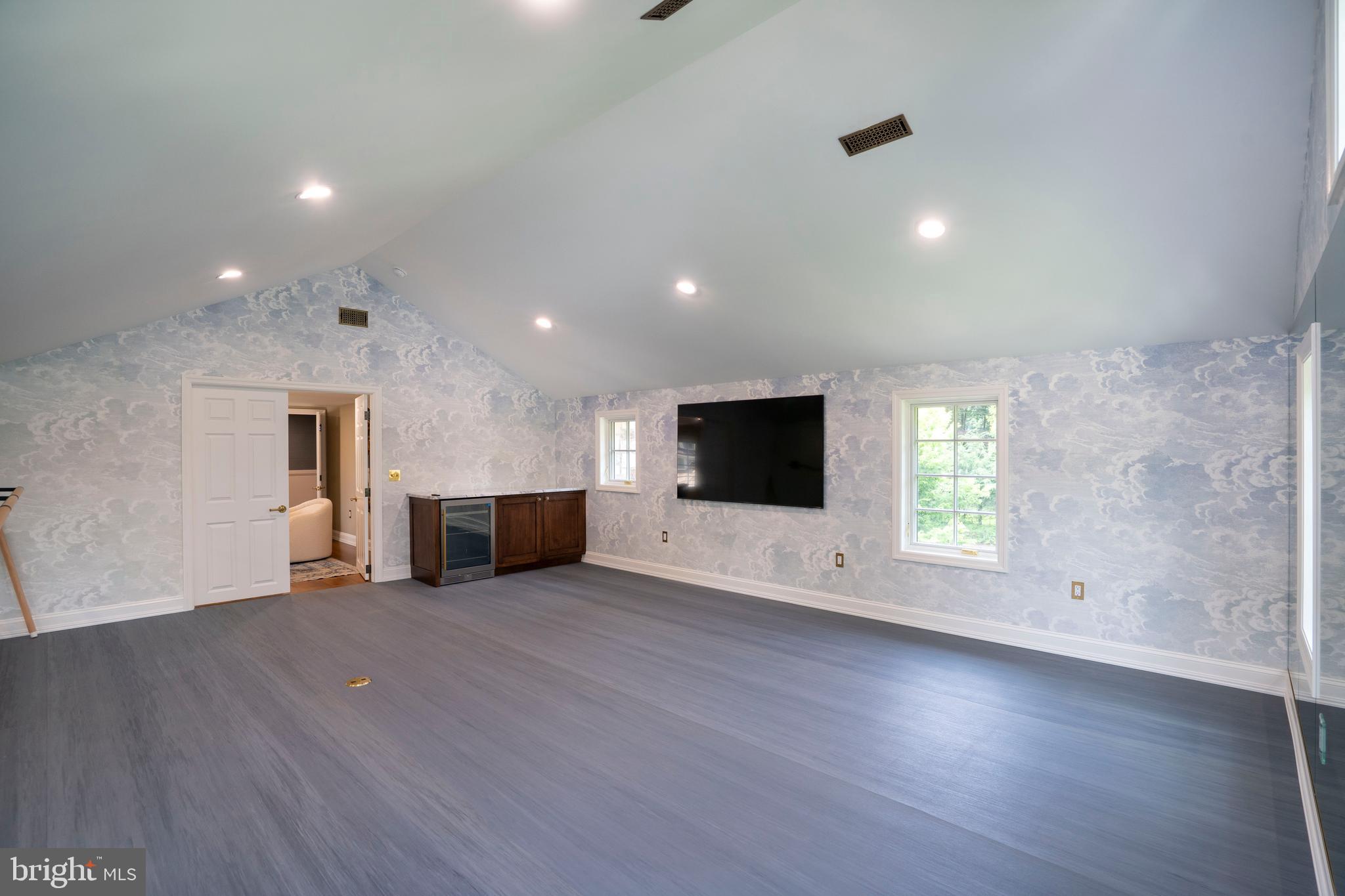 619 McKee Street State College, PA 16803 - Photo 94 of 101 an empty room with wooden floor and a flat screen tv