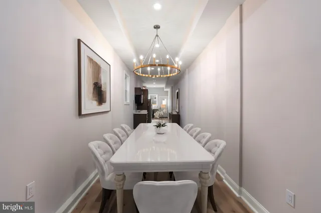 a view of a dining room with furniture and window