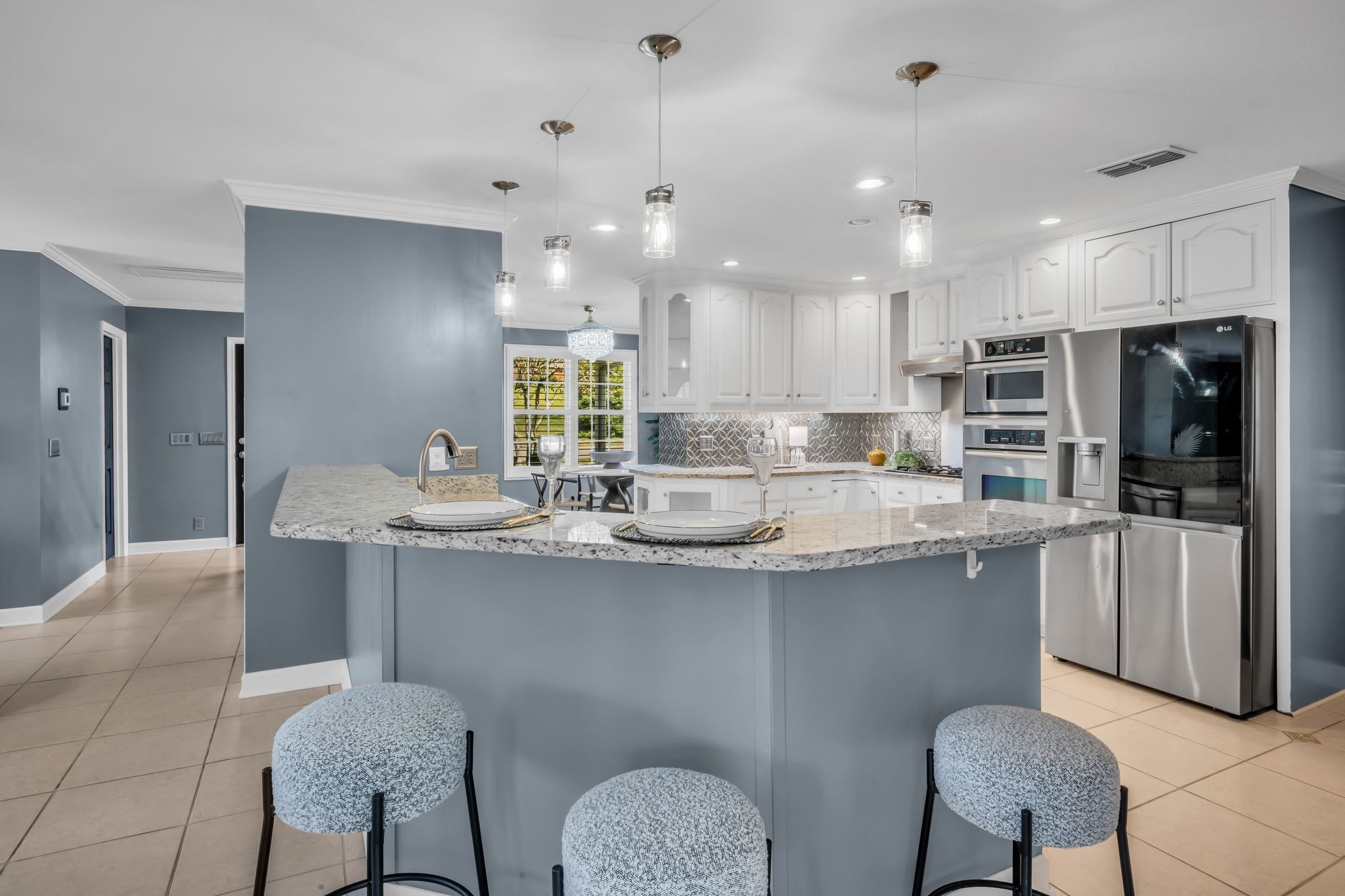 108 Lake Valley Road Dickson, TN 37055 - Photo 19 of 42 a kitchen with refrigerator and chairs