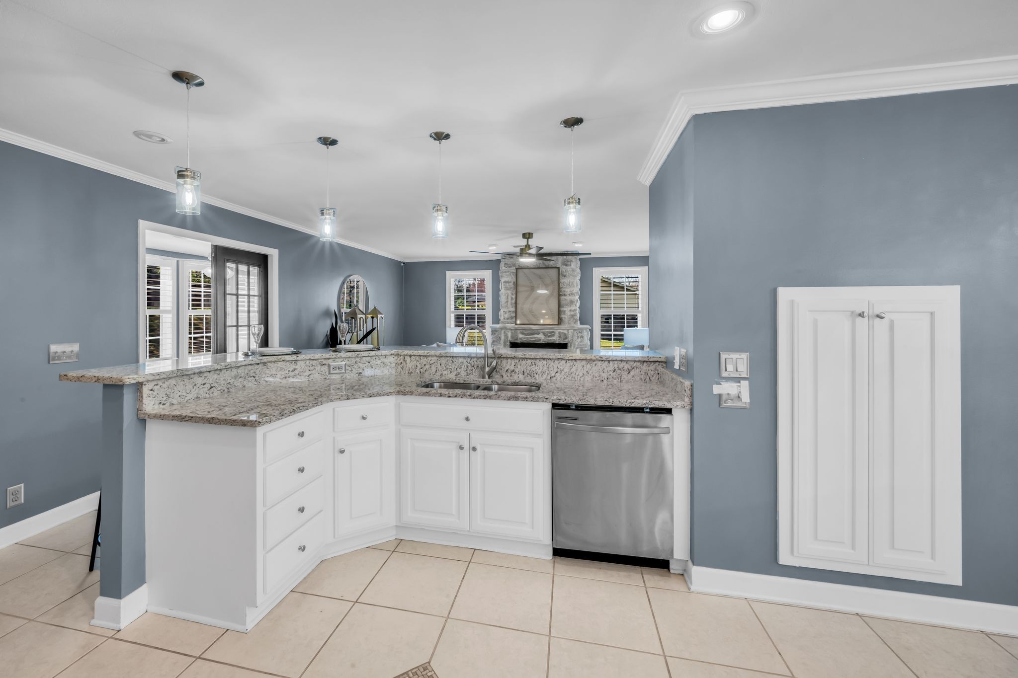 108 Lake Valley Road Dickson, TN 37055 - Photo 21 of 42 a kitchen with granite countertop white cabinets and white appliances