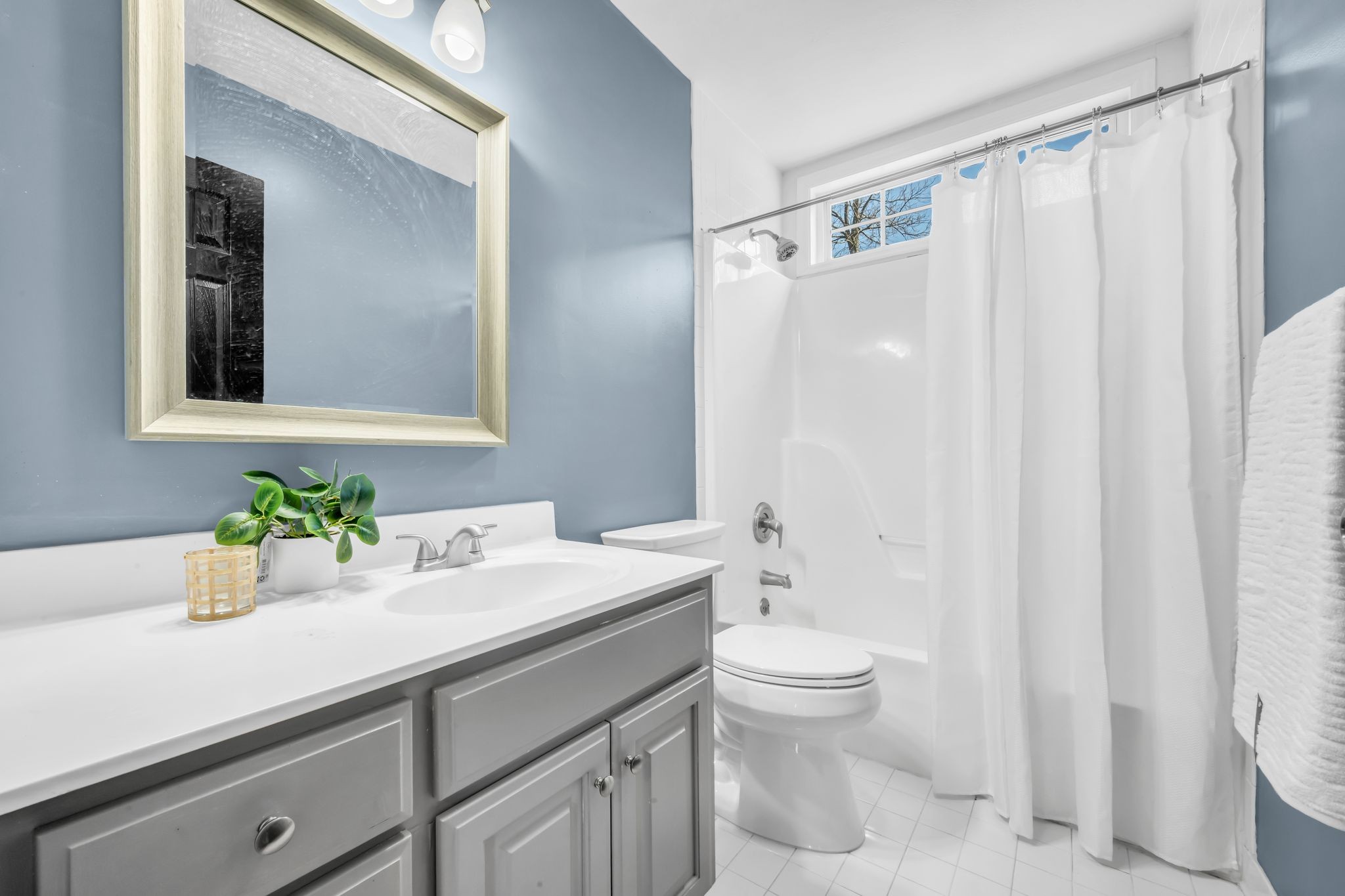 108 Lake Valley Road Dickson, TN 37055 - Photo 33 of 42 a bathroom with a sink a toilet and a mirror