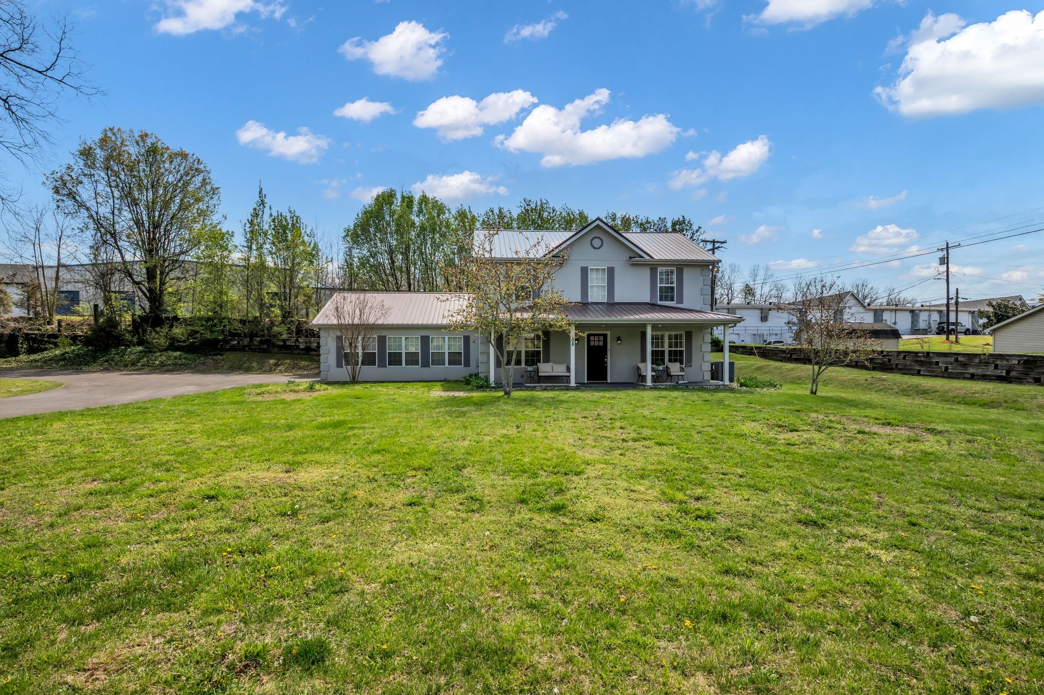 108 Lake Valley Road Dickson, TN 37055 - Photo 38 of 42 a front view of a house with a garden and yard