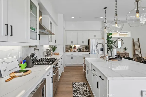 a kitchen that has a lot of cabinets in it