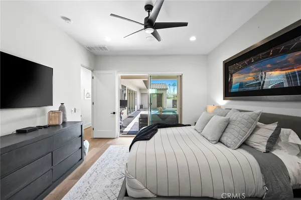 a room with furniture pool table and flat screen tv