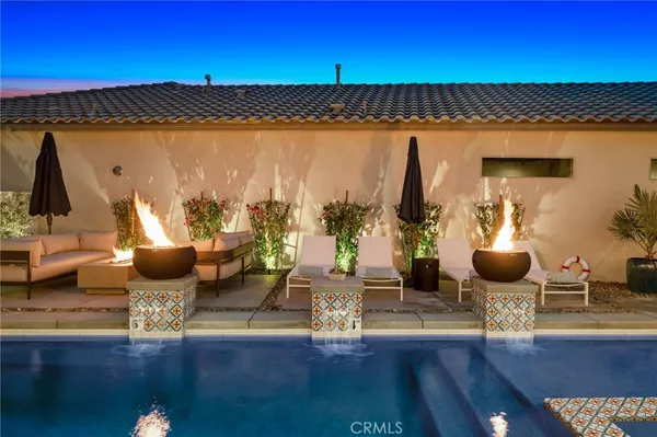 a view of a living room and kitchen